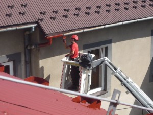 Prace wysokościowe - malowanie dachów Kraków